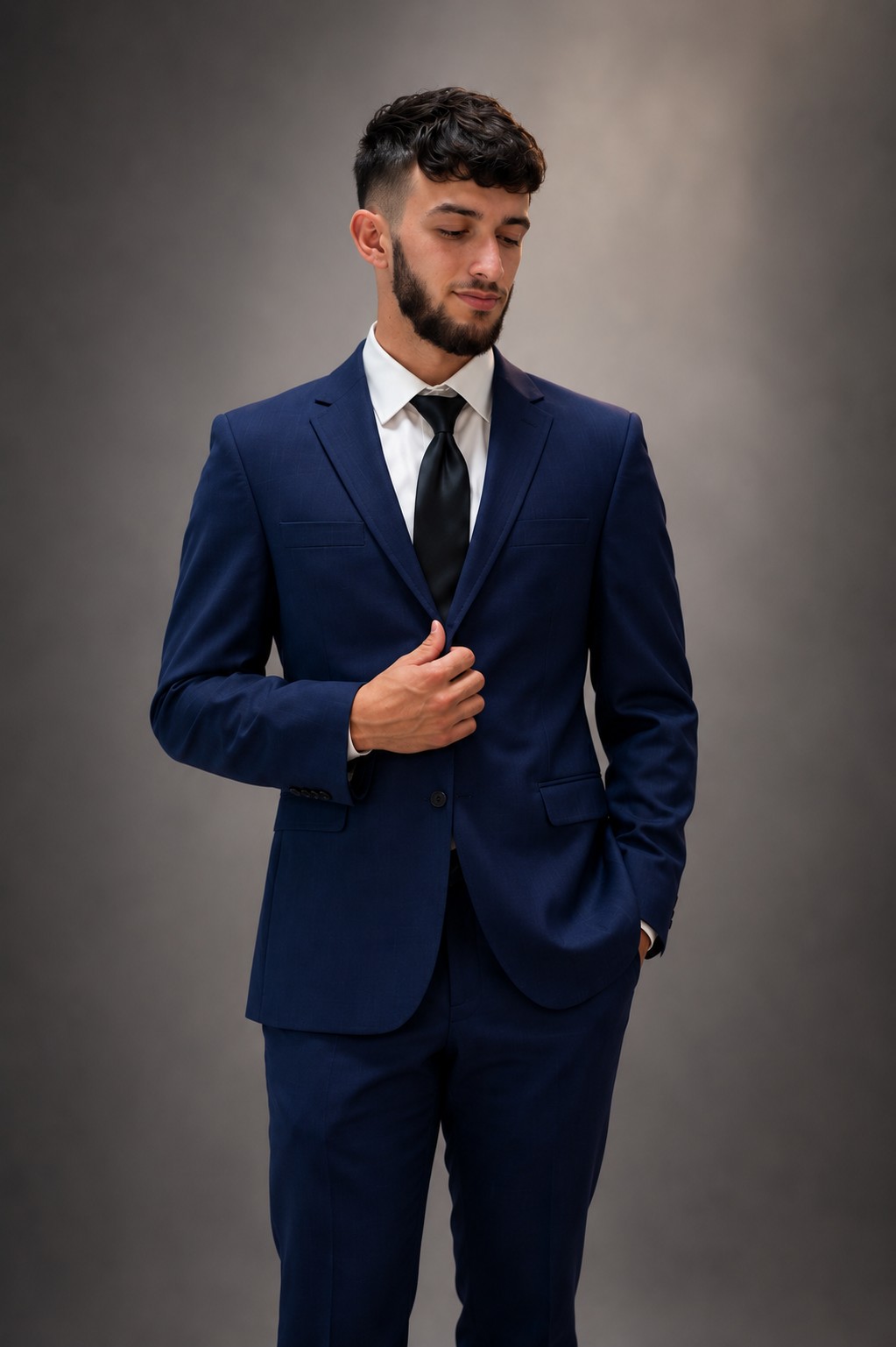 Jaden Shipley wearing a navy suit against a gray background